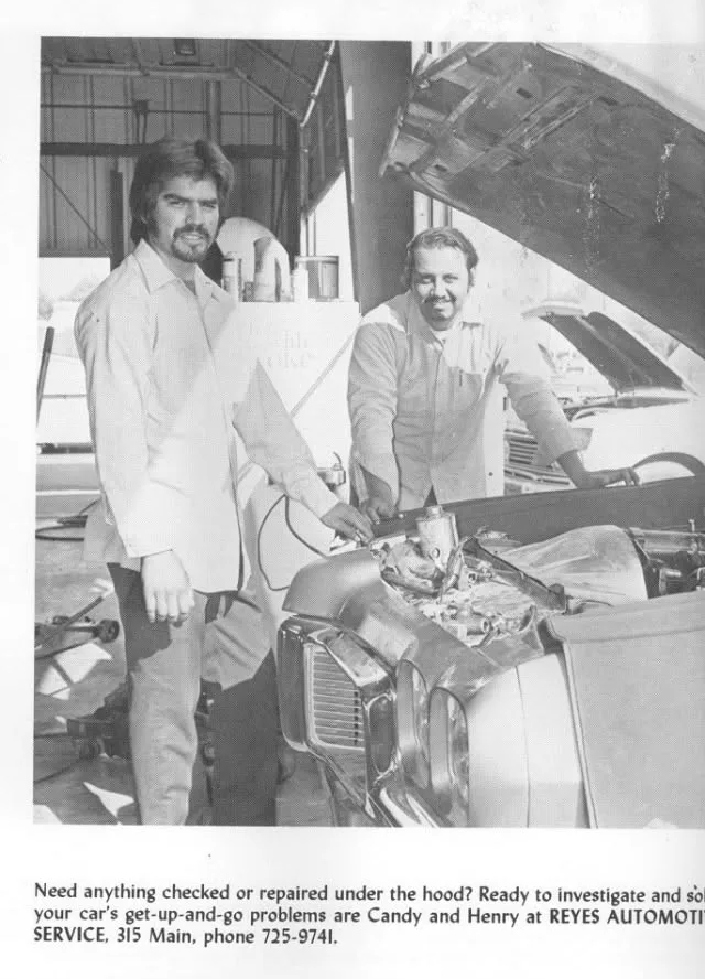 Vintage newspaper ad showing two mechanics under the hood of a classic car, from Reyes' Automotive Service